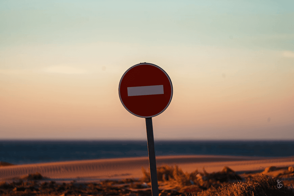 Stop sign on a beach - banned hashtags can stop your reach